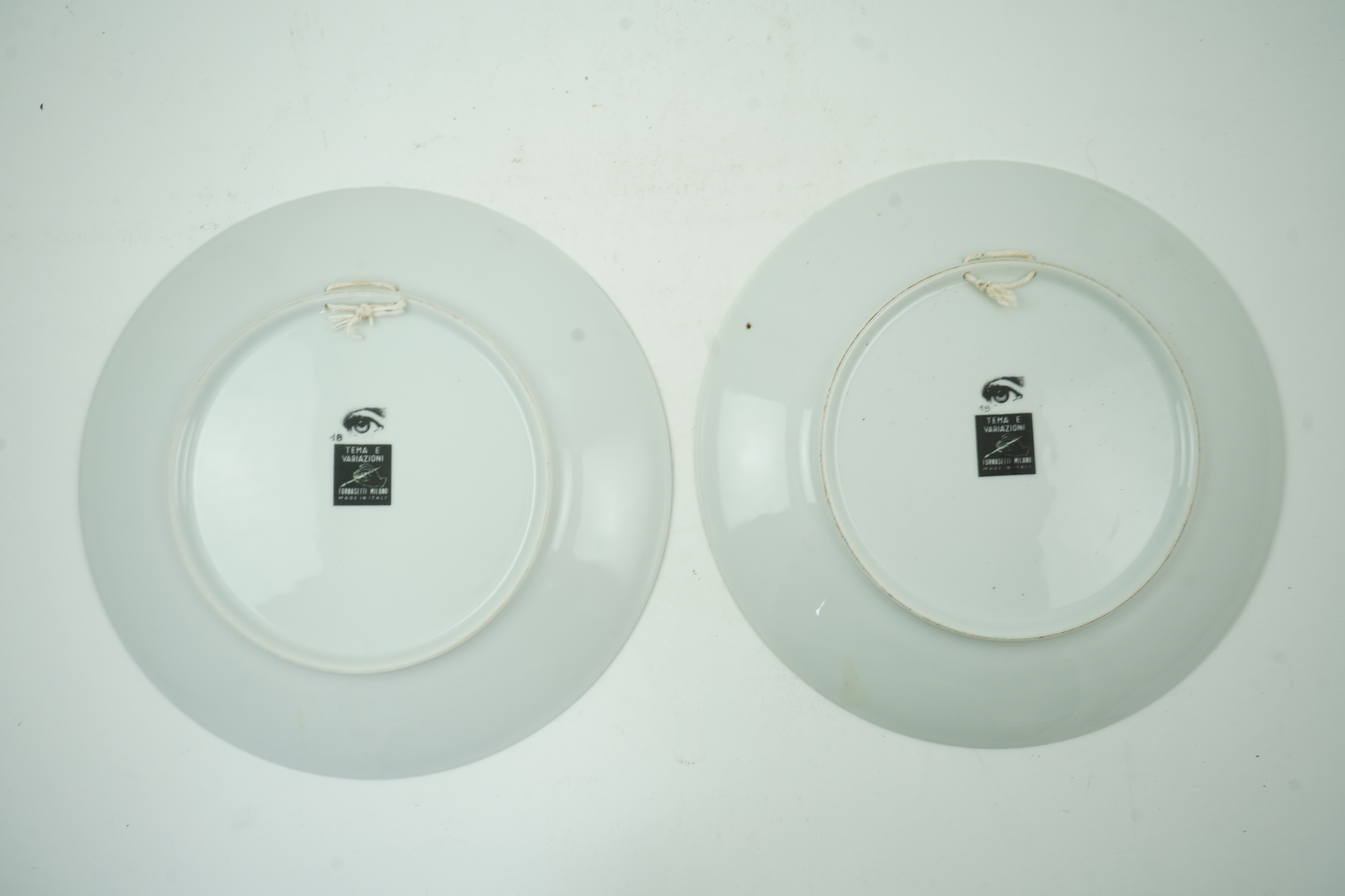 Piero Fornasetti (Italian, 1913-1988): Two 'Tema a Variazioni' plates